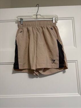 Gymshark Men’s Beige Athletic Shorts with Black Side Panels